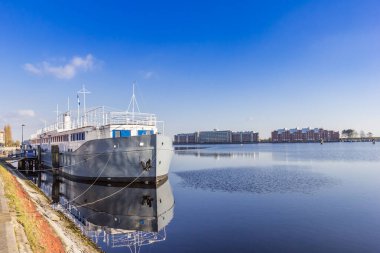 Historic ship at the quay of the canal in Wilhelmshaven, Germany clipart