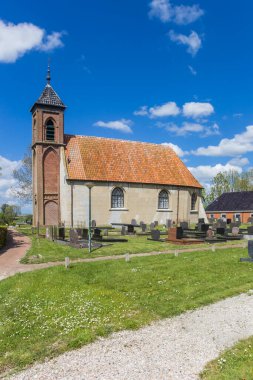 Historic church in the small village of Dorkwerd, Netherlands clipart