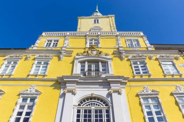 Yellow and white facade of the historic castle in Oldenburg, Germany clipart