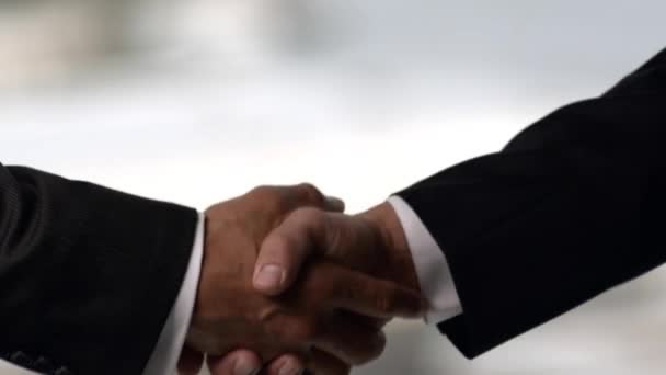 African American Businessmen Shake Hands Blurry Background Closeup Successful Partnership — Stock Video