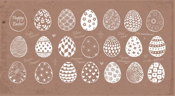 一套在褐色包装纸背景上的涂鸦彩蛋 以不同的语言书写 复活节快乐 — 图库矢量图片