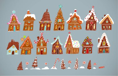 Gri arka planda zencefilli kurabiye evleri, Noel tatlıları ve karlı köknar ağaçları..