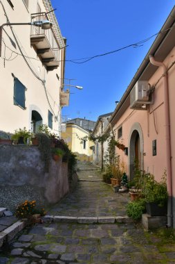 A narrow street among the old houses of Rapolla, a village in the province of Potenza in Italy.