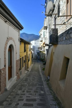A narrow street among the old houses of Rapolla, a village in the province of Potenza in Italy.
