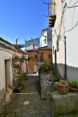 A narrow street among the old houses of Rapolla, a village in the province of Potenza in Italy.