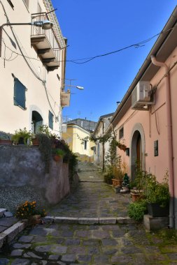 A narrow street among the old houses of Rapolla, a village in the province of Potenza in Italy.