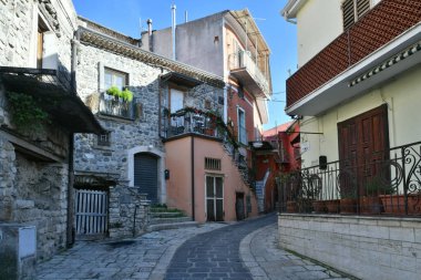 A narrow street among the old houses of Rapolla, a village in the province of Potenza in Italy.