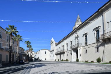 The facade of the cathedral and the bishop's palace in Melfi, a square of the historic town in southern Italy.