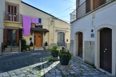 A narrow street among the old houses of Melfi, a village in the province of Potenza in Italy.