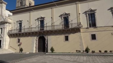  The facade of the cathedral and the bishop's palace in Melfi, a square of the historic town in southern Italy.