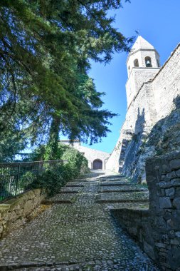 A narrow street between the old houses of Bovino, an ancient town in Puglia, Italy.