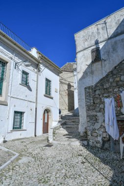 A narrow street between the old houses of Bovino, an ancient town in Puglia, Italy.