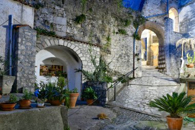 A narrow street among the old houses of Pietravairano, a rural town in the province of Caserta, Italy.