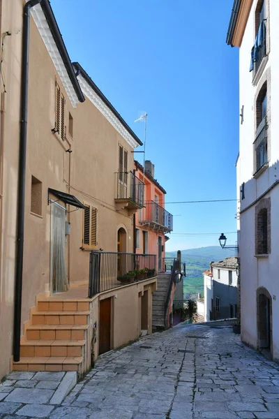 stock image A narrow street among the old houses of Civitacampomarano, a historic town in the state of Molise in Italy.