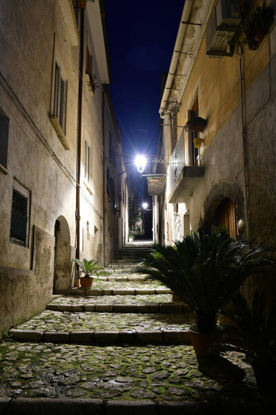 A narrow street between the old houses of Caiazzo, a medieval village in the province of Caserta, Italy.