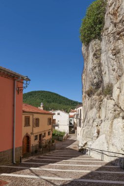 A street between old houses in Pietrabbondante, a village in Molise in Italy. clipart