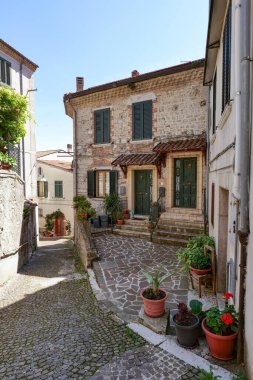 A street between old houses in Carovilli, a village in Molise in Italy. clipart