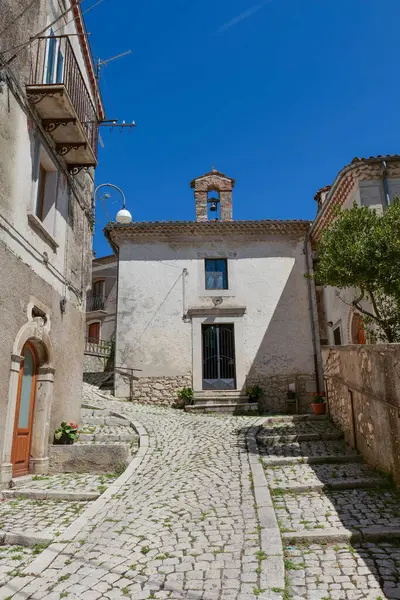 stock image A street between old houses in Carovilli, a village in Molise in Italy.