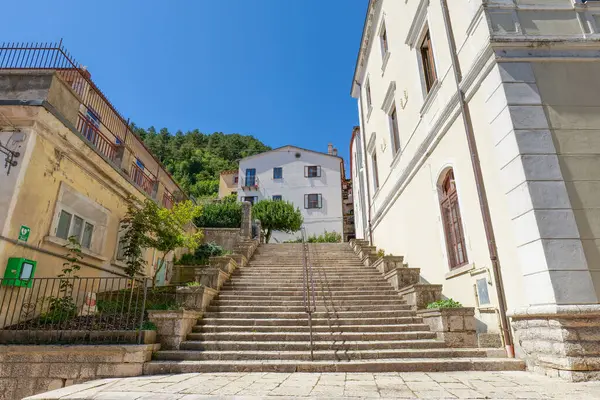 stock image A street between old houses in Carovilli, a village in Molise in Italy.