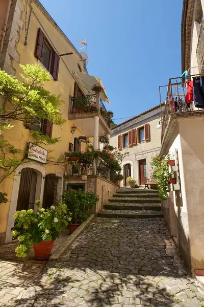 stock image A street between old houses in Carovilli, a village in Molise in Italy.