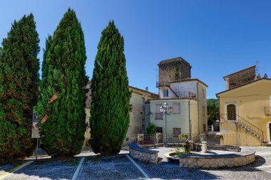 A street between the old houses of Fontechiari in Lazio, Italy. clipart