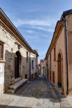 A small street in Noepoli, a village in Basilicata in Italy. clipart