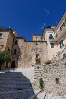 A street between the old houses of Alvito in Lazio, Italy. clipart