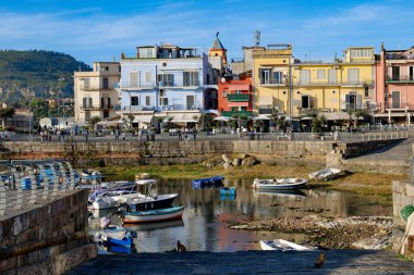 Boats in the ancient port of Pozzuoli in Italy. clipart