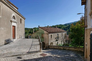 A road between the old houses of Sepino, a village in Molise, Italy. clipart