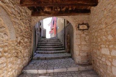 A road between the old houses of Sepino, a village in Molise, Italy. clipart