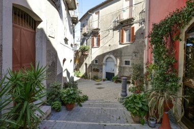 A road between the old houses of Sepino, a village in Molise, Italy. clipart