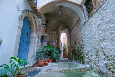 A street among the old houses of a historic district of the city of Gaeta, Italy. clipart