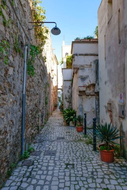 A street among the old houses of a historic district of the city of Gaeta, Italy. clipart