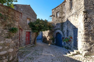 A narrow street between the houses of old Caserta, a medieval village in Italy. clipart