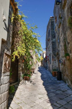 A narrow street between the houses of old Caserta, a medieval village in Italy. clipart