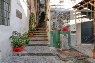 A characteristic street of Vierti sul Mare, a picturesque town famous for the art of ceramics in Italy.. clipart