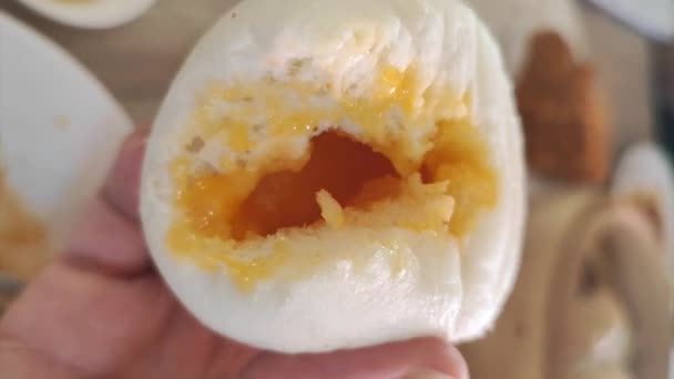 Closeup Half Salted Egg Yolk Custard Lava Bun Hand Fingers — ストック動画