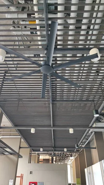 Ceiling fan on steel sheet rooftop