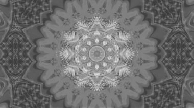Beyaz ve gri dalgaların kaleydoskopik deseni göz kamaştırıcı ve renkli bir görüntü yaratıyor..