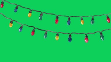 Yeşil ekran arkaplanındaki Noel sicim ışıkları