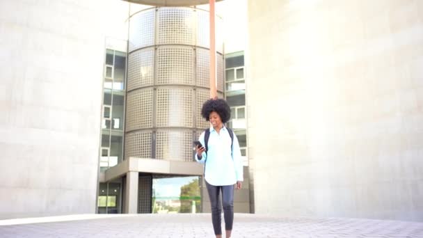 Positive Young African American Female Student Afro Hair Walking Her — 图库视频影像