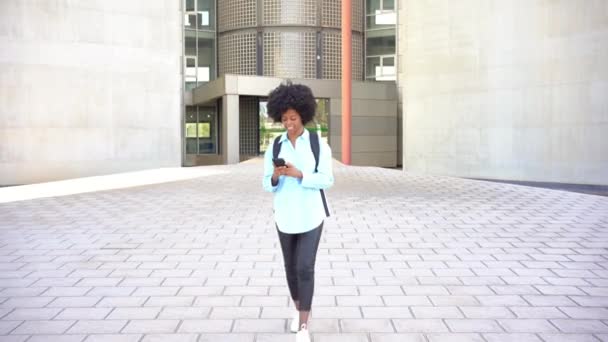 Positive Young African American Female Student Afro Hair Walking Her — Vídeo de stock