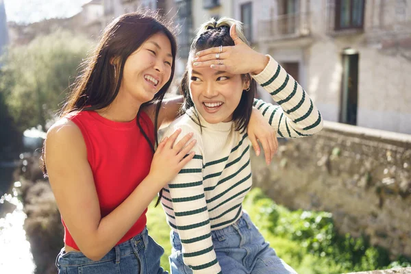 Happy Young Asian Woman Sitting Hand Shoulder Cheerful Girlfriend While — Stock Photo, Image
