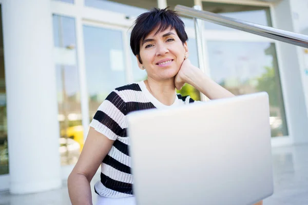 Cheerful Adult Female Freelancer Striped Shirt Smiling Looking Camera While — Stock Photo, Image
