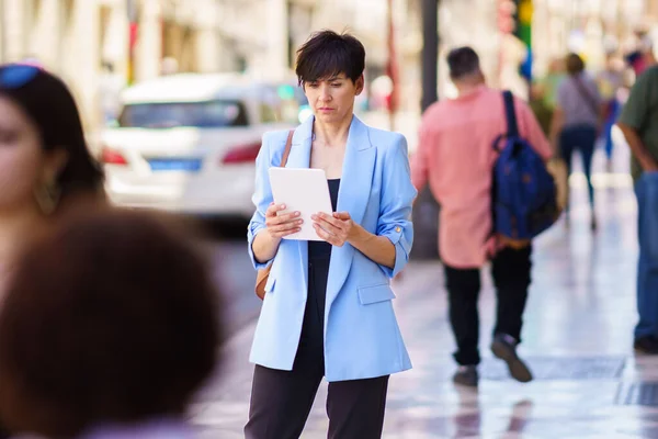 Serious Woman Smart Casual Clothes Handbag Standing Street Looking Screen — Stock Photo, Image