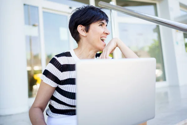 Positive Adult Female Freelancer Short Hair Smiling Looking Away While — Stock Photo, Image