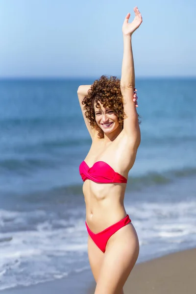 Cheerful Young Female Redhead Pink Bikini Standing Touching Outstretched Arm — Stock Photo, Image