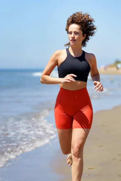 Smiling Curly Haired Barefoot Young Female Sportswear Warming Looking Away — Stock Photo, Image