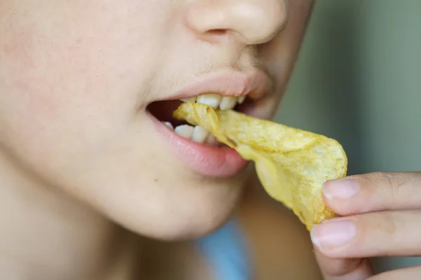 Closeup Crop Anonymous Young Girl Biting Crunchy Potato Chip Home — Stock Photo, Image