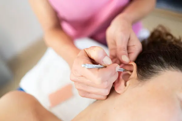 Crop Professional Beautician Applying Auriculotherapy Ear Acupuncture Techniques Female Client — Stock Photo, Image